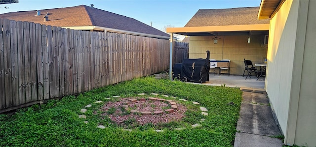 view of yard with a patio area and a fenced backyard