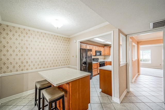 kitchen with wallpapered walls, light countertops, crown molding, a textured ceiling, and black appliances