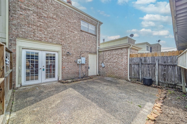 view of patio / terrace with french doors and fence