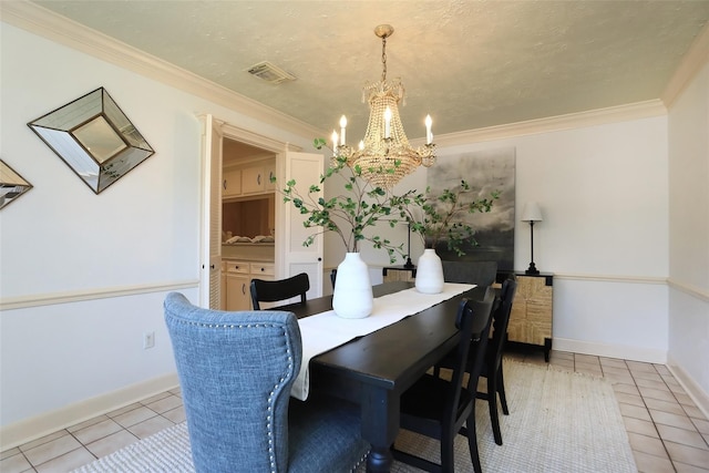 dining space featuring light tile patterned floors, visible vents, baseboards, ornamental molding, and an inviting chandelier