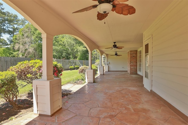 view of patio with a fenced backyard and a ceiling fan