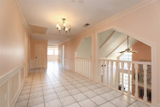 spare room with ornamental molding, visible vents, a decorative wall, and light tile patterned floors