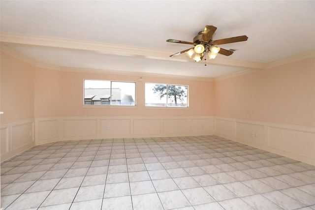 unfurnished room with light tile patterned flooring, a ceiling fan, and a decorative wall