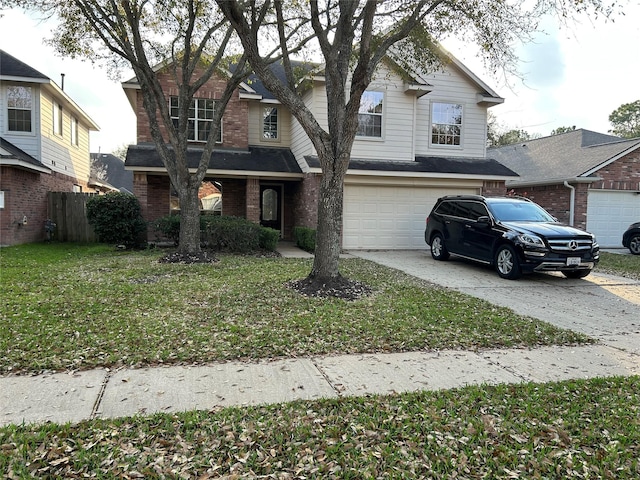 traditional home featuring a garage, brick siding, fence, driveway, and a front yard