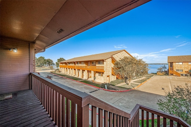 balcony featuring a water view