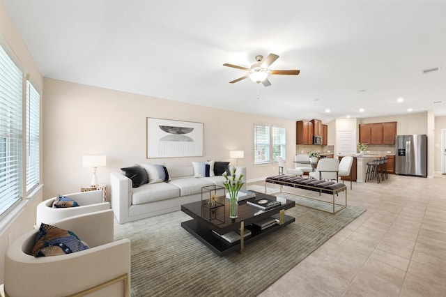 living room with recessed lighting, visible vents, a ceiling fan, light tile patterned flooring, and baseboards