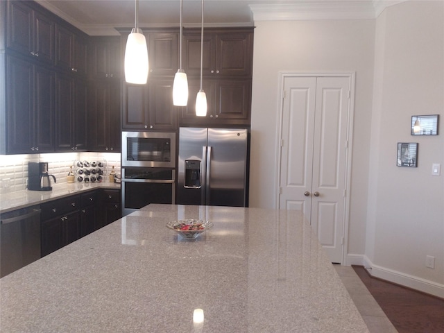 kitchen with stainless steel appliances, crown molding, backsplash, and light stone countertops