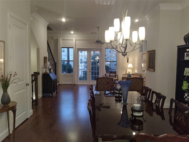 dining area featuring french doors, ornamental molding, wood finished floors, baseboards, and ceiling fan with notable chandelier