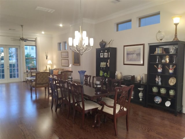 dining space featuring ornamental molding, french doors, visible vents, and wood finished floors