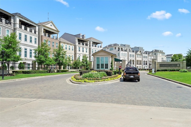 view of road with a residential view and curbs