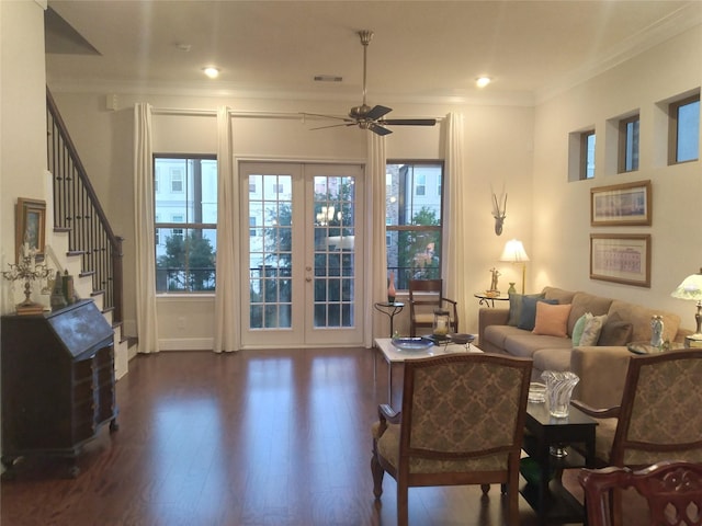 living room featuring visible vents, stairs, french doors, dark wood finished floors, and crown molding