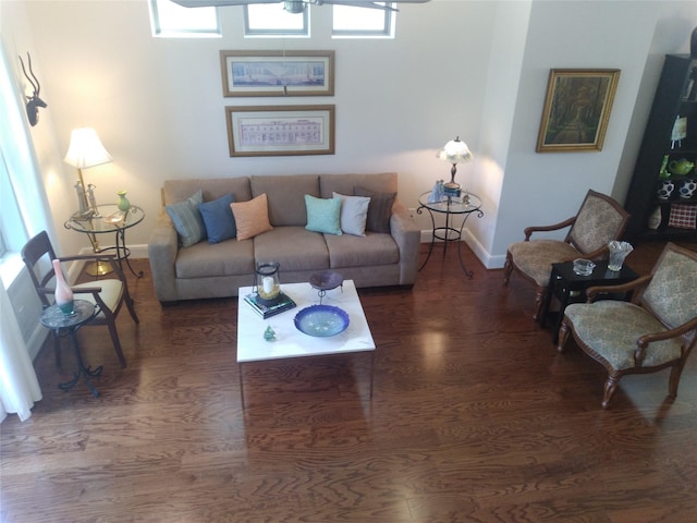 living room featuring baseboards and wood finished floors