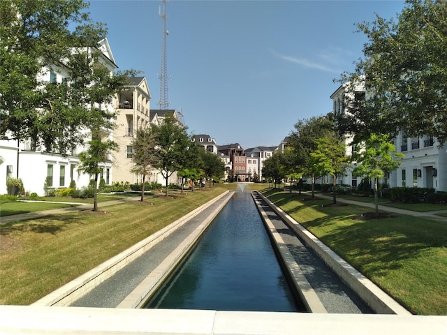 view of street with sidewalks, a residential view, and curbs