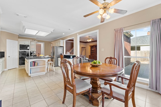 dining area with visible vents, a ceiling fan, stairs, crown molding, and light tile patterned flooring