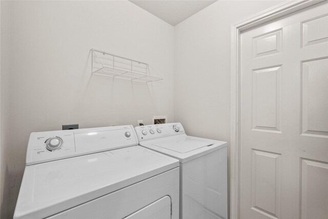 washroom with laundry area and washing machine and clothes dryer