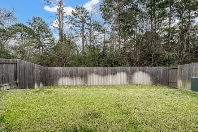 view of yard with a fenced backyard