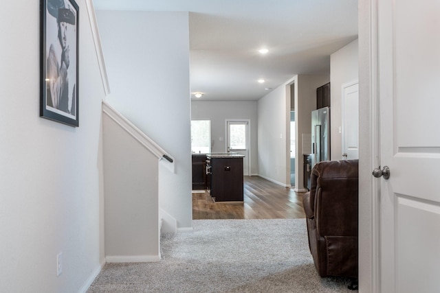 corridor featuring recessed lighting, stairway, carpet, and baseboards