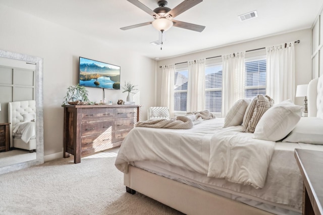 bedroom featuring visible vents, carpet floors, and ceiling fan