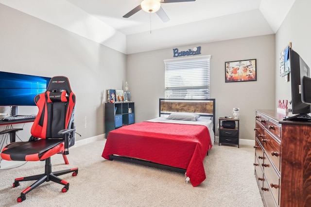 carpeted bedroom with baseboards, a ceiling fan, and vaulted ceiling