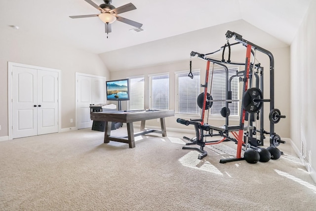 workout room featuring baseboards, visible vents, lofted ceiling, ceiling fan, and carpet flooring