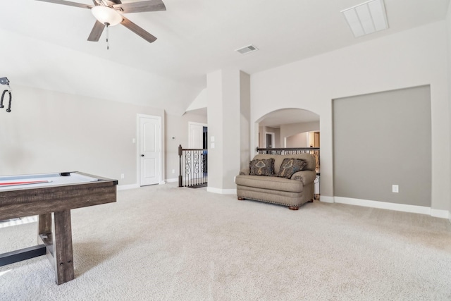 playroom with baseboards, visible vents, carpet floors, and arched walkways