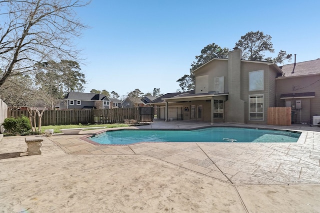 view of swimming pool featuring a fenced backyard, a patio, and a fenced in pool
