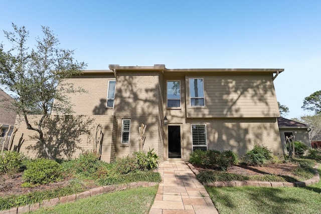 view of front of house featuring brick siding