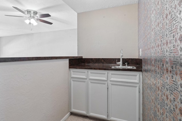 bathroom featuring ceiling fan and vanity