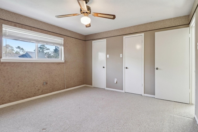 unfurnished bedroom featuring ceiling fan, baseboards, carpet flooring, and a closet