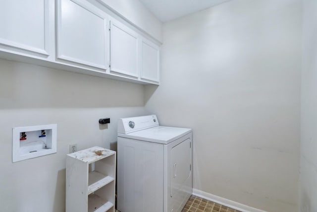 laundry area with cabinet space, washer / dryer, and baseboards