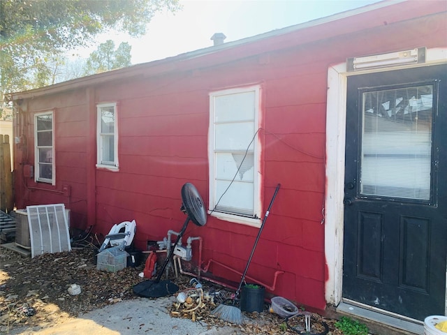 view of side of property with central AC unit