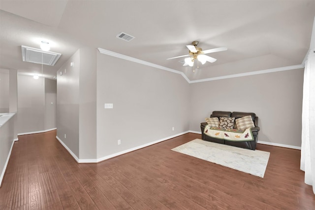 unfurnished room featuring visible vents, attic access, ceiling fan, wood finished floors, and baseboards