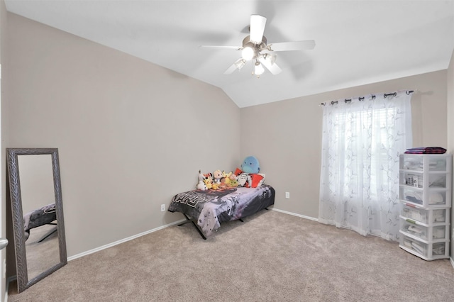 bedroom with lofted ceiling, carpet, a ceiling fan, and baseboards