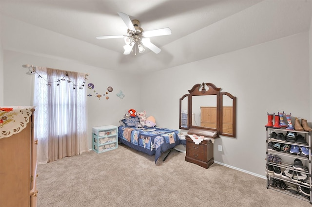 bedroom with a ceiling fan, carpet, and baseboards