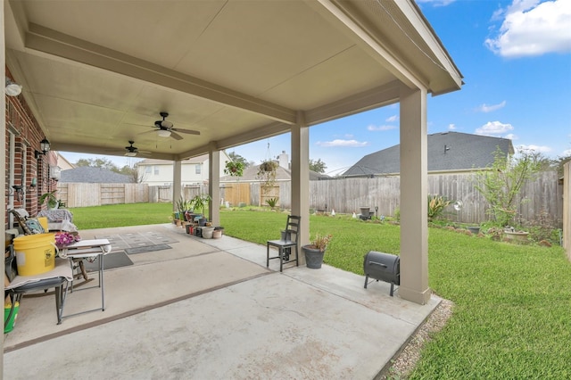 view of patio / terrace with a fenced backyard and a ceiling fan