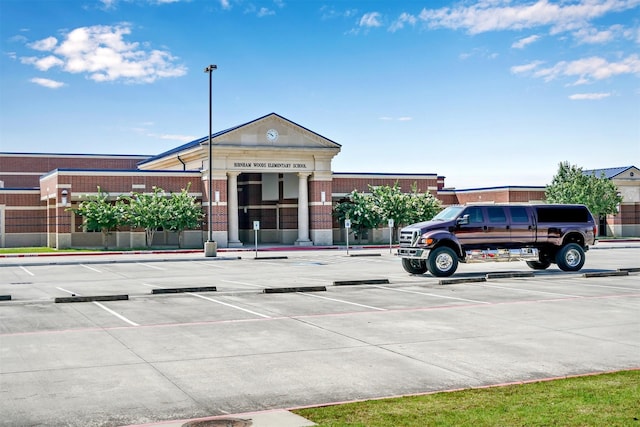 view of property with uncovered parking