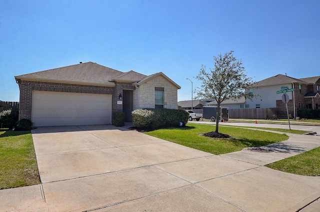 view of front of house with a garage, a front yard, concrete driveway, and brick siding