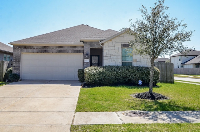 view of front of property featuring an attached garage, brick siding, fence, driveway, and a front yard