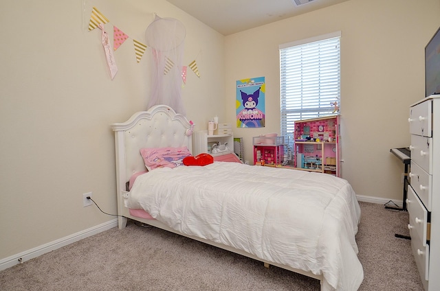 bedroom with carpet floors, visible vents, and baseboards