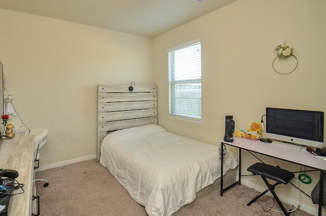 carpeted bedroom with baseboards