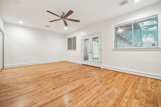 spare room with light wood-type flooring, visible vents, recessed lighting, and french doors