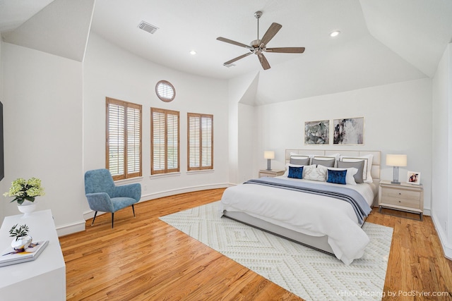 bedroom with visible vents, wood finished floors, recessed lighting, baseboards, and vaulted ceiling