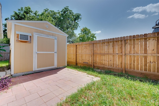 view of shed with a fenced backyard