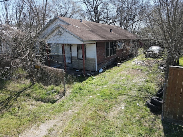 view of side of property featuring concrete block siding