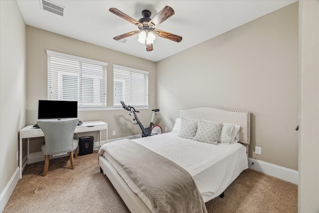 bedroom featuring a ceiling fan, light colored carpet, visible vents, and baseboards