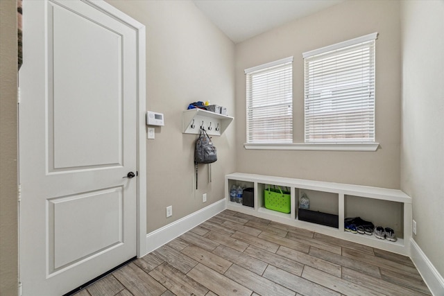 mudroom with baseboards and wood finished floors