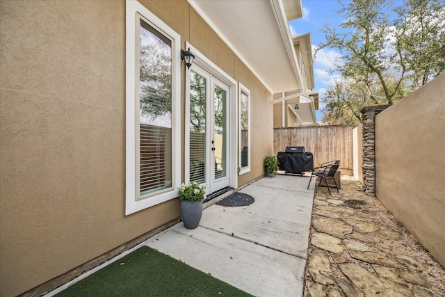 view of patio with fence and grilling area