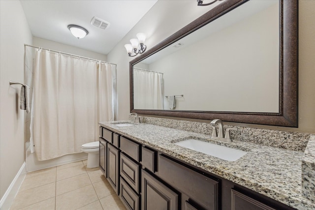 bathroom with toilet, a sink, visible vents, and tile patterned floors