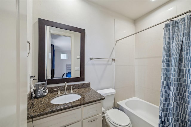 bathroom with toilet, shower / tub combo with curtain, and vanity