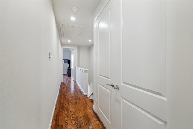 corridor with baseboards, dark wood finished floors, and recessed lighting